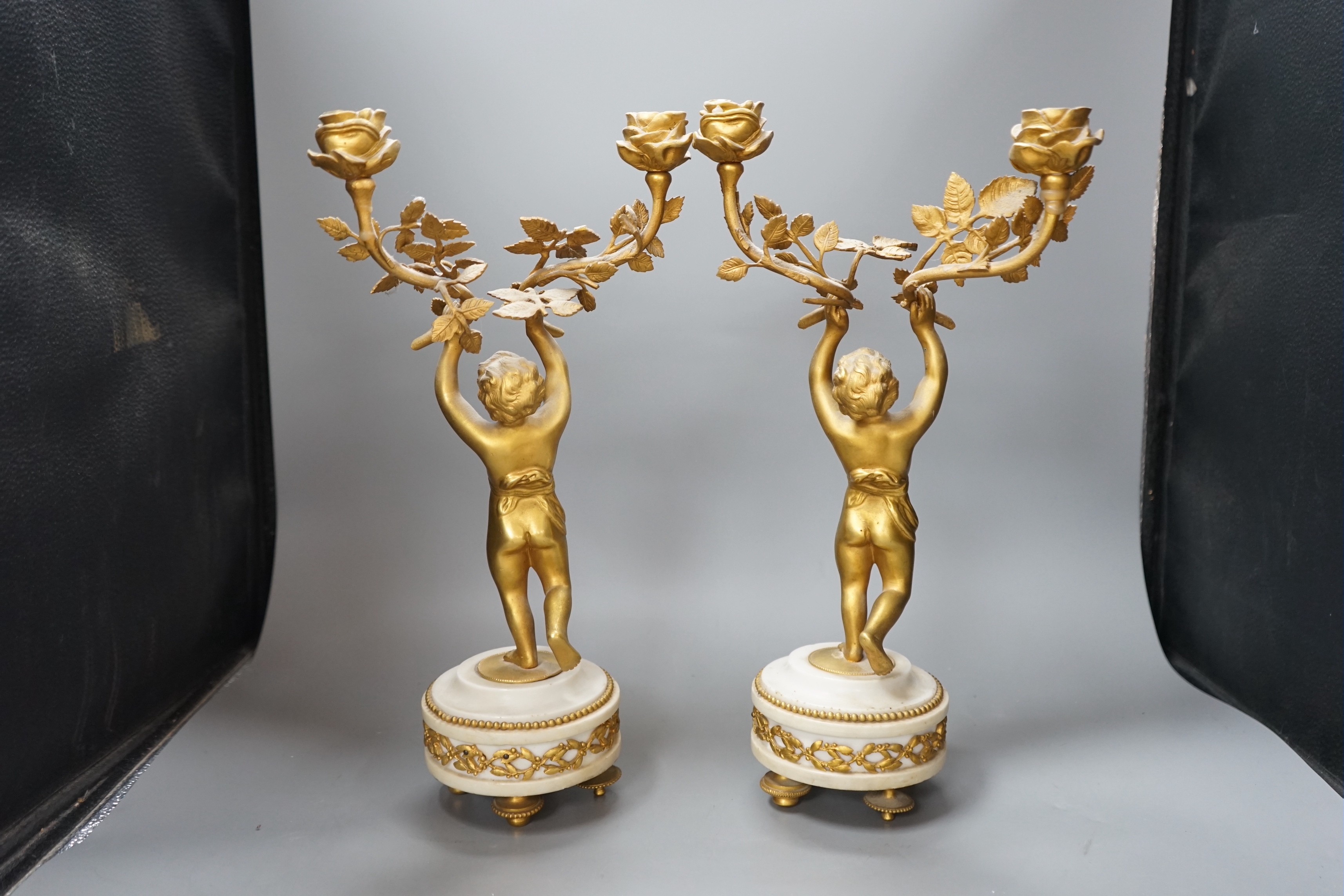 A pair of Louis XVI style ormolu figural candelabra, 41cm